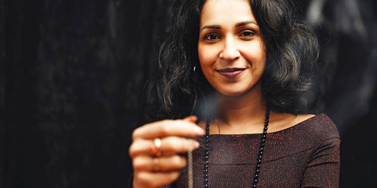 Psychic language Fortune teller smiles at the camera