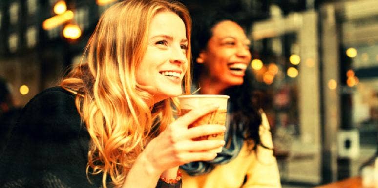 women drinking pumpkin spice latte