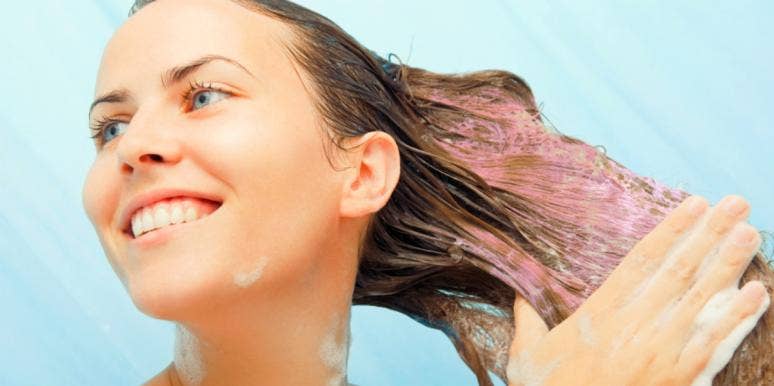 Never Use Purple Shampoo On Dry Hair: The Critical Reason Why woman using purple shampoo