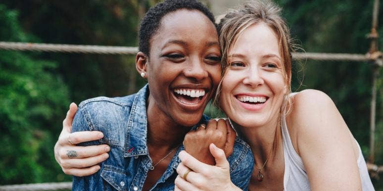 racist patterns black woman with white woman hugging