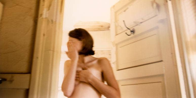 woman hiding face naked 