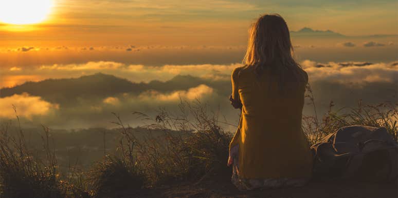 Read This If You're Waiting To Be Happy woman sitting in sunset