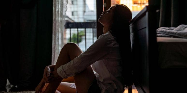 Real Thoughts I Had When My Teenage Bully Died sad woman in dark room
