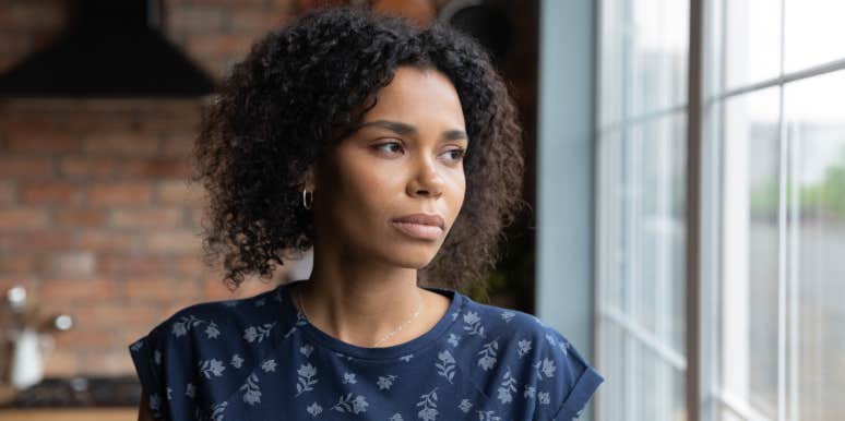 Woman Says Sister Had An Affair With Her Husband & Now Wants Her To Be In Their Kids' Lives woman looking out window