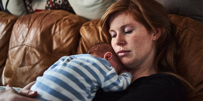 I Wanted A Baby My Whole Life — And Now I Regret Having One woman with baby on chest