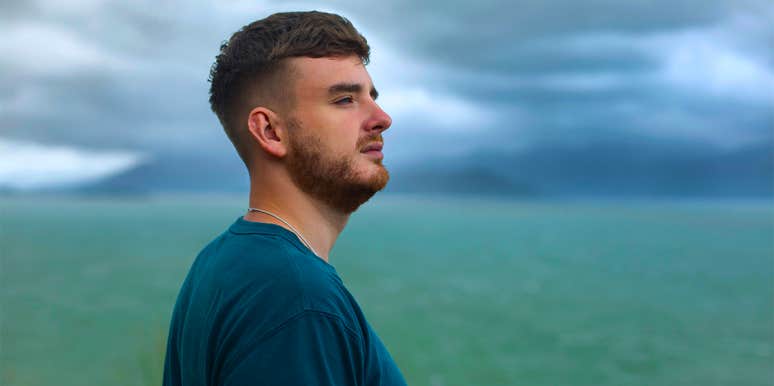 Top 10 Complaints Men Have About Women, According To 500 Guys man standing by ocean looking out