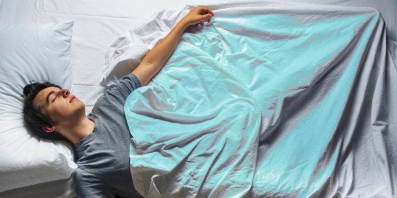 4 Common Relationship Dreams And What They Mean man sleeping in bed