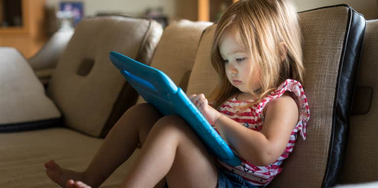little girl using tablet