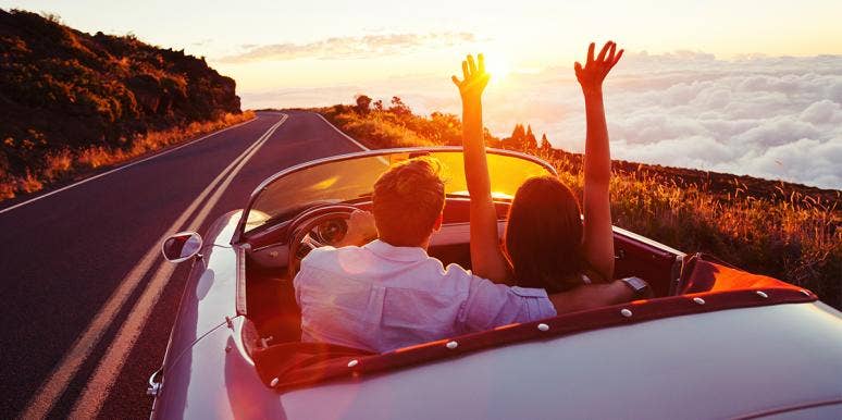We Met On Twitter — And Our First Date Was A Week-Long Road Trip couple in car at sunset