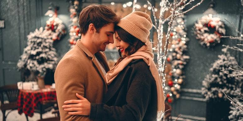 45 Best Romantic Christmas Love Songs Of All Time couple holding each other in winter clothing