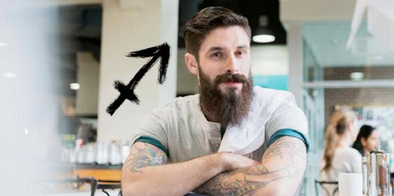Sagittarius Man: Love, Traits & Characteristics bearded man with sagittarius symbol