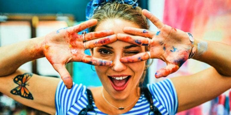 Sagittarius Woman: Zodiac Sign Dates, Personality Traits & Facts woman with paint on her hands