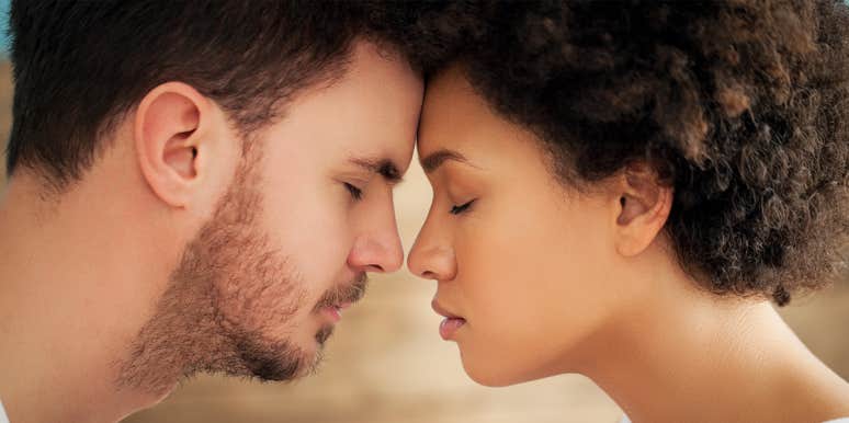 man and woman touching noses in an intimate way
