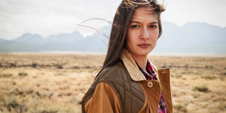 How I Saved Myself From An Emotionally Abusive Man — And You Can, Too woman standing in desert in brown coat
