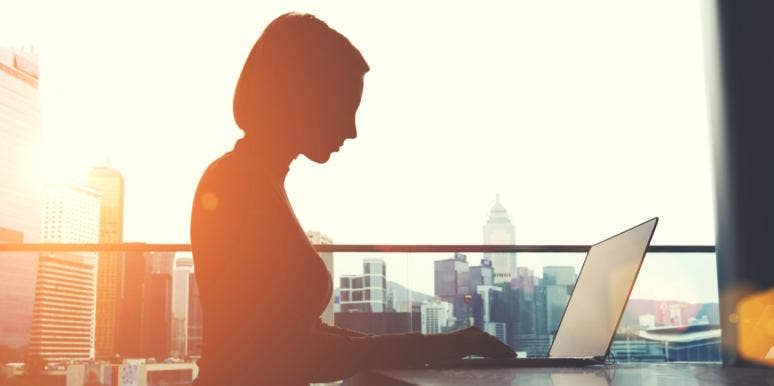 Science Confirms Men Are Intimidated By Smart Women woman in shadow on laptop