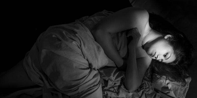 The Secret Fantasy Life Of A Sexual Assault Victim sad woman laying in bed