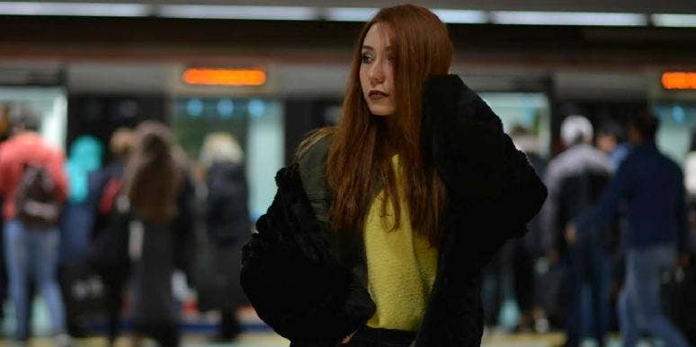 What It's Like To Still See Your Face In Every Crowd woman in a crowd of people