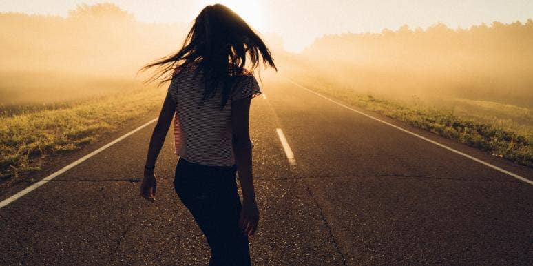woman on a road seeing the light woman on a road seeing the light