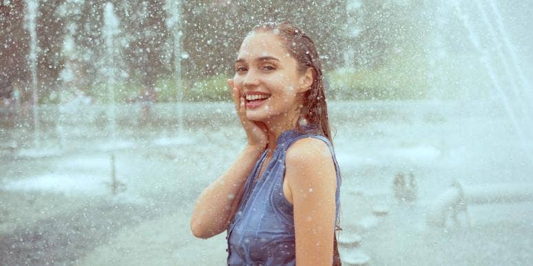 self-awareness examples happy woman in the rain