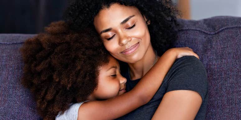 post pandemic self-care for parents mom and daughter cuddle on couch
