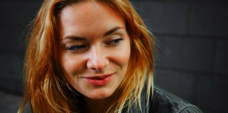 How Self-Reflection Changed Everything I Looked For In A Guy woman smiling and thinking