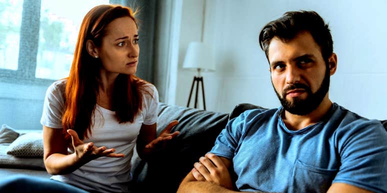 woman sitting on couch fighting with her selfish husband