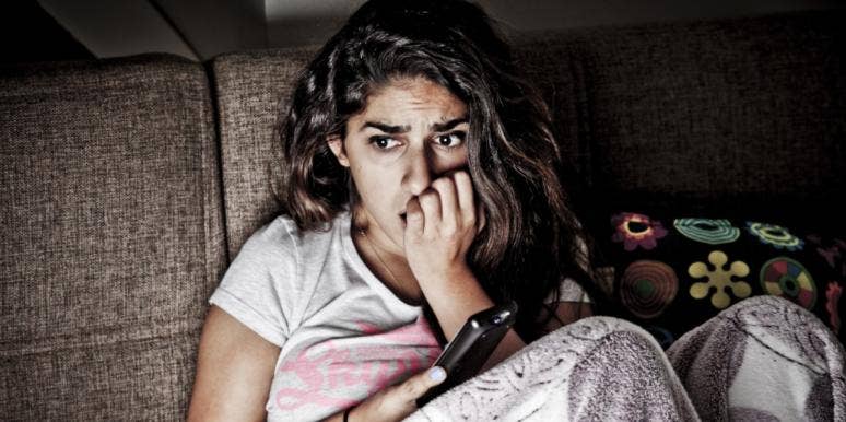 serial killers and true crime stories scared woman watching serial killers and true crime stories
