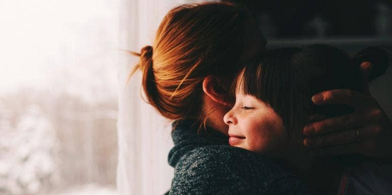 setting a good example with divorce woman hugging little girl