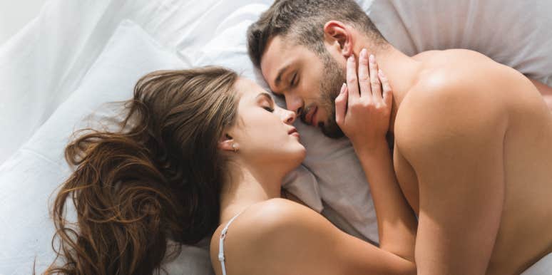 man and woman sleeping in bed
