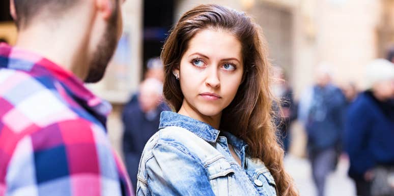 Shifting blame Woman looks at arrogant man in disbelief