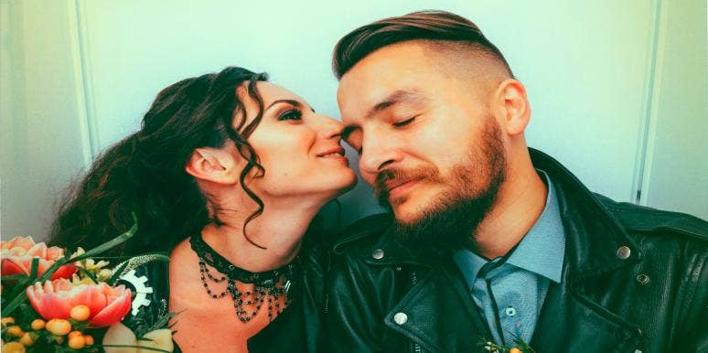 Should I Call My Ex: 10 Reasons Not To woman holding flowers kissing man