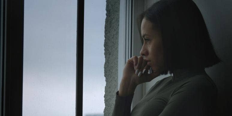 The 4 Most Important Questions To Ask Yourself Before Deciding To Get Divorced sad woman looking out window