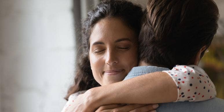 wife hugging husband with closed eyes wife hugging husband with closed eyes