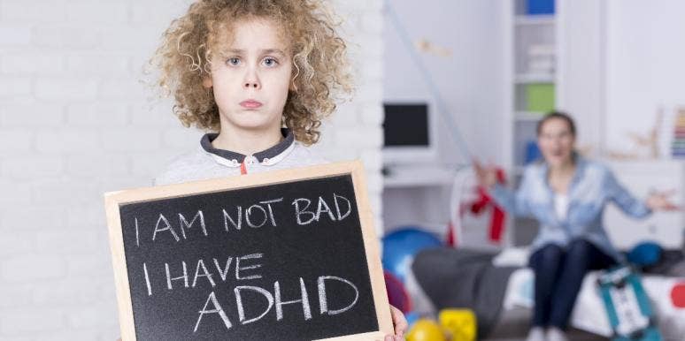 ADHD misconceptions kid holding adhd sign