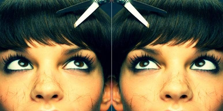30 Trendy Side Bangs To Try 2021 woman with scissors cutting side bangs