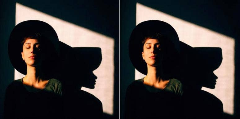 7 Signs You're Suffering From Emotional Exhaustion woman in hat sitting in the dark