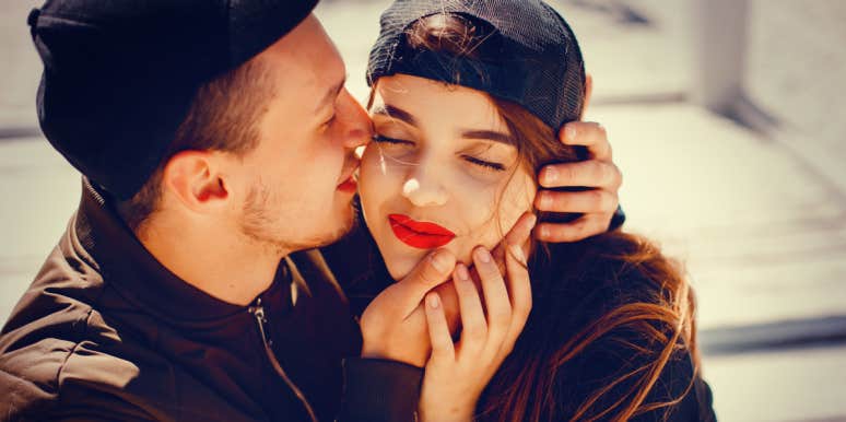 signs a guy is boyfriend material couple with brown hair, man kissing woman's cheek