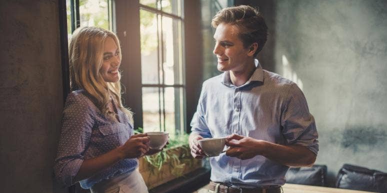15 Signs He Wants You To Notice Him Back man and woman drinking coffee together