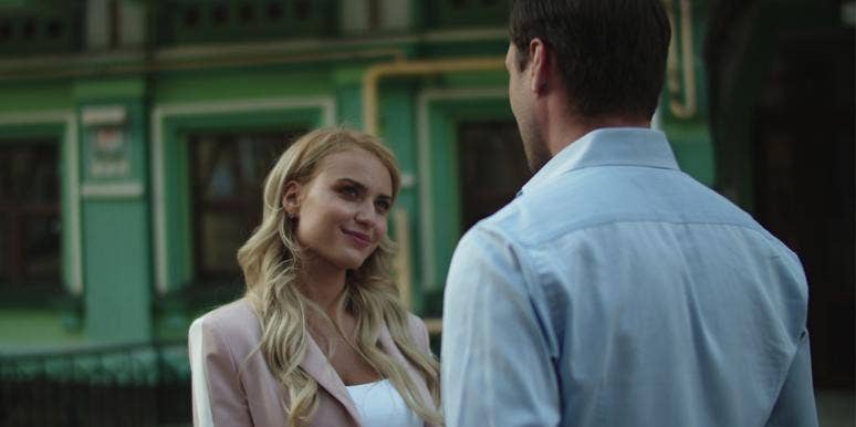 13 Signs That He's Not That Into You, Even When You've Been Dating A While woman and man talking