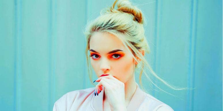 13 Signs Of Resentment That Cause Big Relationship Problems woman red eyeshadow thinking
