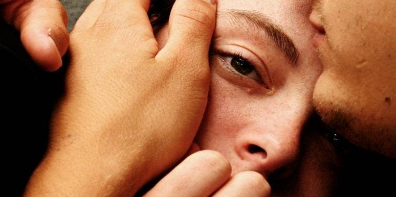 10 Easy-To-Miss Signs Of A Codependent Marriage woman's face and head being held in someone's hands