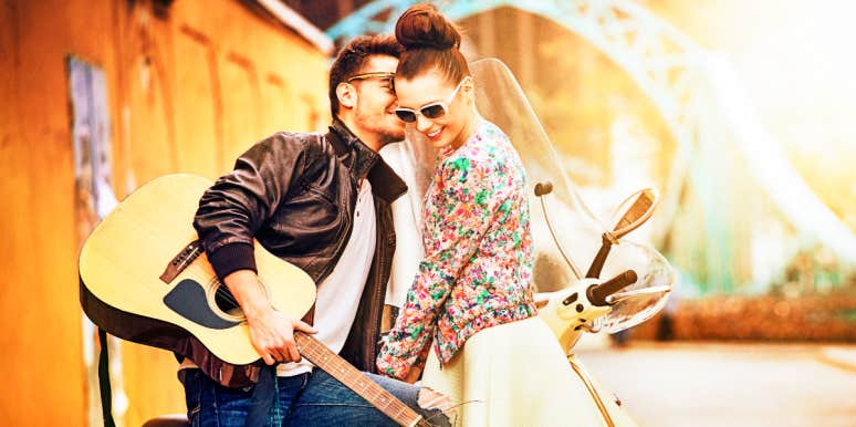 Signs of infidelity Man with guitar whispers to woman