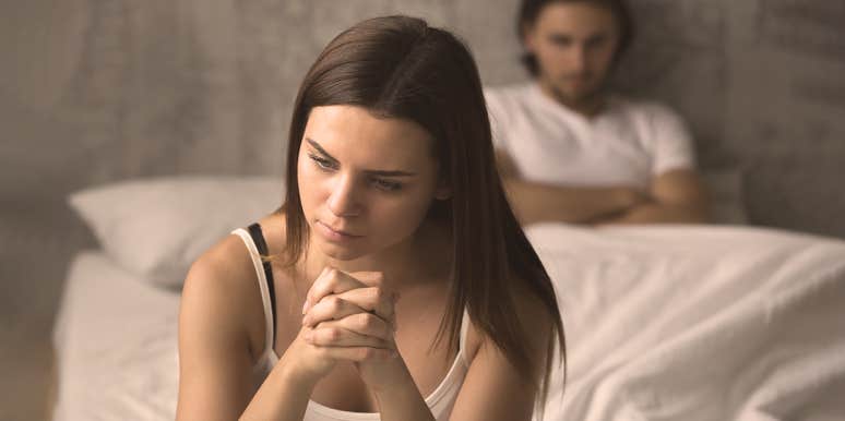 12 Tell-Tale Signs You're A Rebound For Him woman sitting on bed thinking