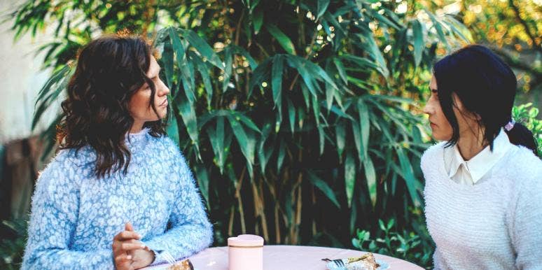 16 Clear Signs Someone Is Jealous Of You two woman talking over a meal