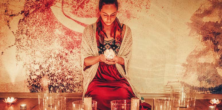 spiritual woman holding lotus candle
