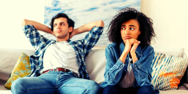 Signs You Need To Lose Him Like A Bad Habit woman sitting on couch with boyfriend she knows she needs to break up with