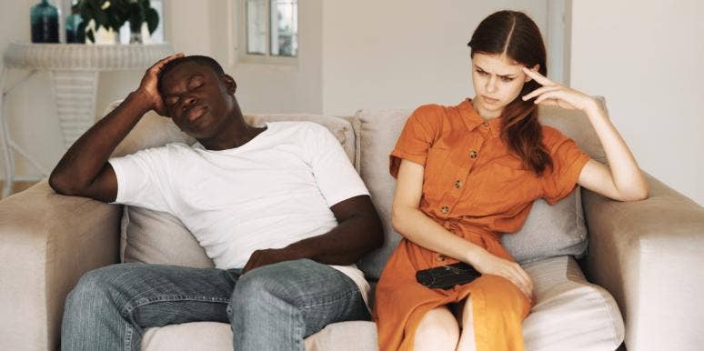 8 Warning Signs Your Wife Wants To Leave You upset man and woman sitting on the couch