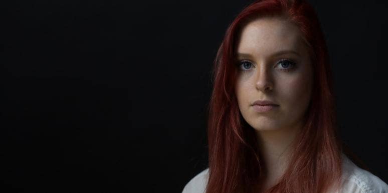 5 Signs You’re Unintentionally Living A Toxic Life woman in dark