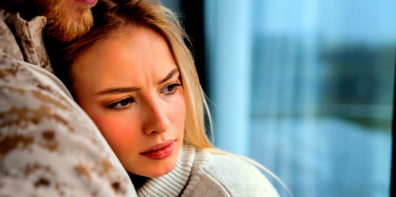 woman hugging man feeling unsure if she is still in love