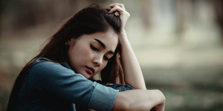 If These 9 Things Sound Familiar, You're Settling In Your Relationship woman thinking alone